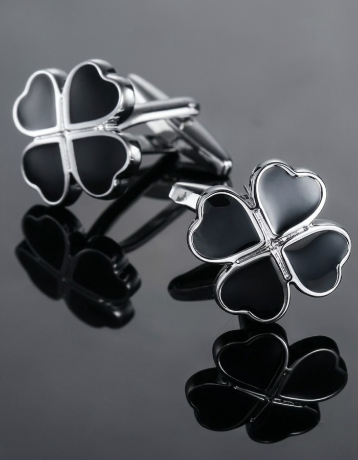 Metal cufflinks with black clovers