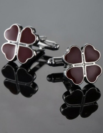 Metal cufflinks with red clovers
